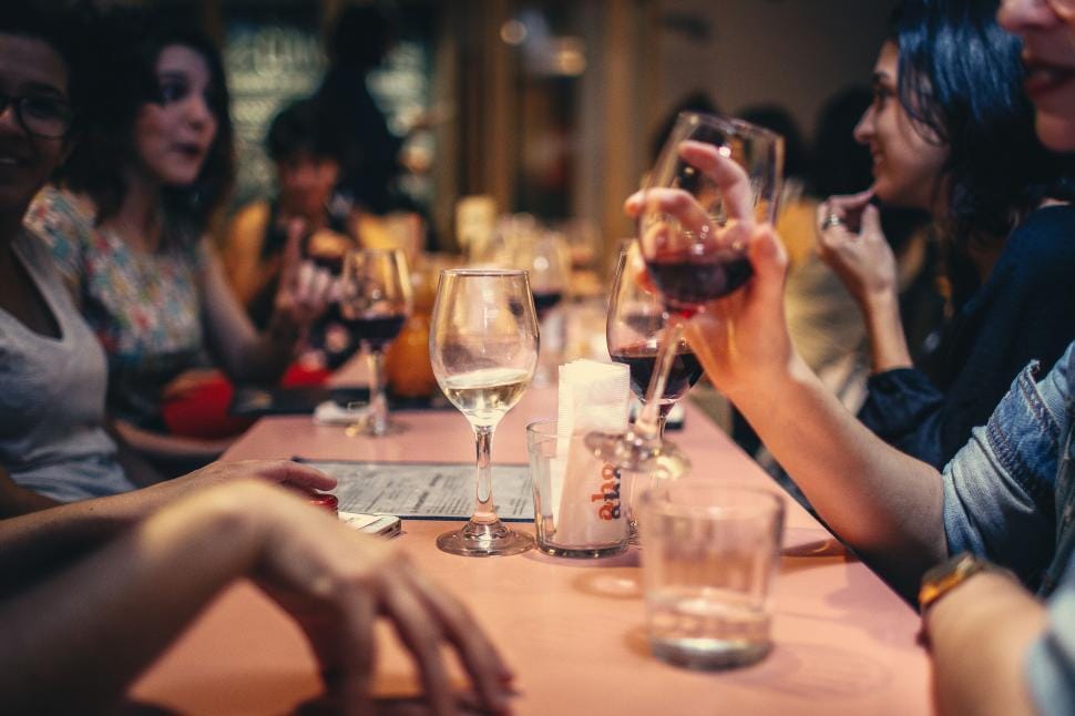Friends sharing wine at the table